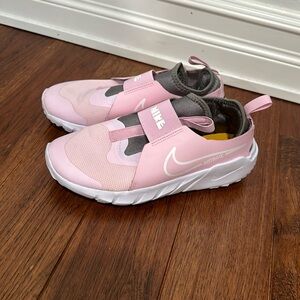 Pink and white Nike shoes